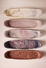 Load image into Gallery viewer, Set of five marbleized stone trays in various colors on a beige background
